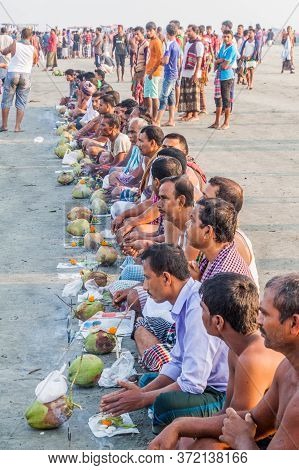 Dublar Char, Bangladesh - November 14, 2016: Hindu Devotees Praying Before Their Holy Dip During Ras