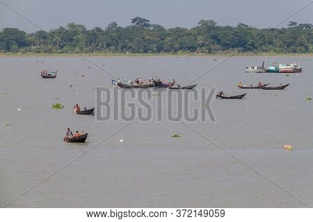 Katcha River, Bangladesh - November 19, 2016: Fisherman On A Small Boat On Katcha Kacha River, Bangl