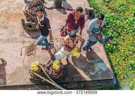 Hularhat, Bangladesh - November 19, 2016: Vendors Waiting For A Ship At Hularhat Launch Ghat Pier , 