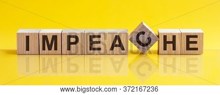 Impeache The Word Is Written On A Wooden Block. The Image Is Mirrored In The Glossy Surface. For You