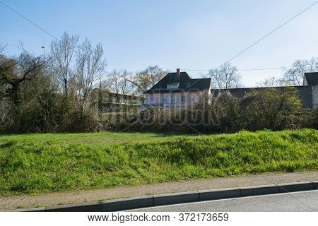 View From The Street Of Generic House In Strasbourg Alsace And Bridge In Background Near The Industr