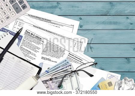 Irs Form W-4 Employees Withholding Certificate Lies On Flat Lay Office Table And Ready To Fill. U.s.