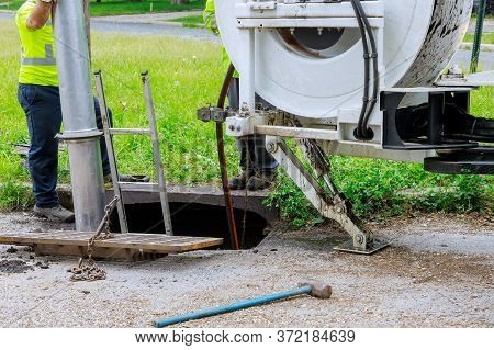 Machine For For Cleaning Blocked Drains Sewer Wells In The A Town Street.