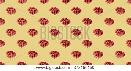 Pattern Of Bananas. Fresh Red Banana Isolated On Yellow Background.