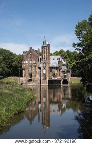 Bazel, Belgium, June 1, 2020, Wissekerke Castle A Moated Castle With The Reflection In The Water