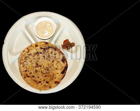 Paratha Chai With Pickle In Plate Morning Breakfast In India Over Dark Black Background With Space F