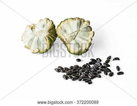 Sugar Apple Half Fruit Cutted And Black Seeds Isolated On White Background, Dicut With Clipping Path