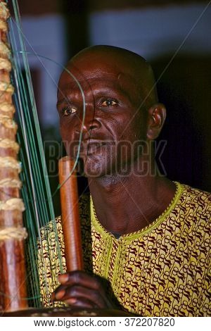 Senegal, Africa - Marsch Circa, 2016. Unidentified Black Man Playing Traditional African Music Durin
