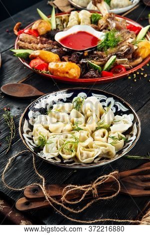 Oriental Traditional Dishes Georgian Chuchvara Dumplings And Assorted Different Meat, Vertical