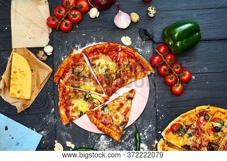 Pizza With Mozzarella Cheese, Tomatoes, Mushrooms, Peppers, Herbs On A Dark Wooden Background.