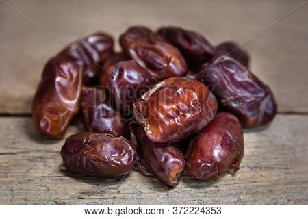 Dried Dates On Wooden Table, Sort Chewy Khidri, Sweet Vegan Superfruit