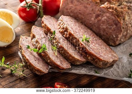 Homemade Ground Meatloaf With Eggs Tomatoes Celery Herbs And Thyme.