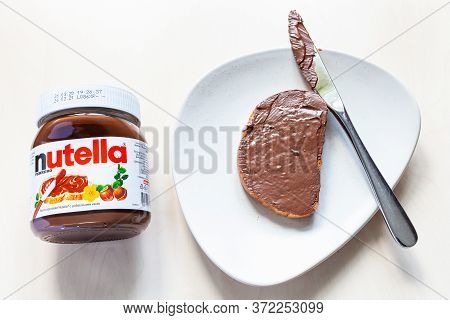 Moscow, Russia - June 16, 2020: Top View Of Lying Jar Of Nutella And Toast With Sweetened Hazelnut C