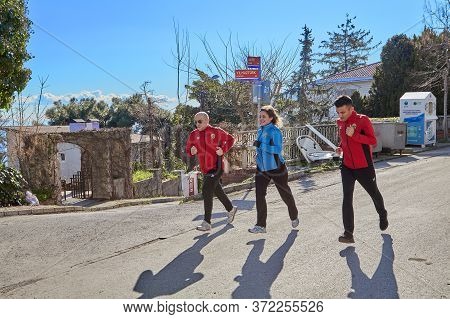 Istanbul, Turkey - February 13, 2020: Jogging Holidaymakers On The Island Of Buyukada One Of The Pri