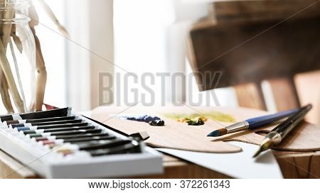 Artist Equipment Putting On Wooden Working Table. Paint Brush, Oil Color, Palette Putting Together O