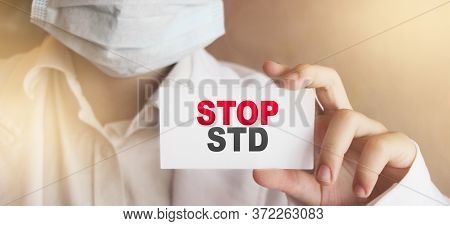 Doctor Holding A Card With Text Stop Std Medical Concept. Sexualy Transmitted Diseases Concept