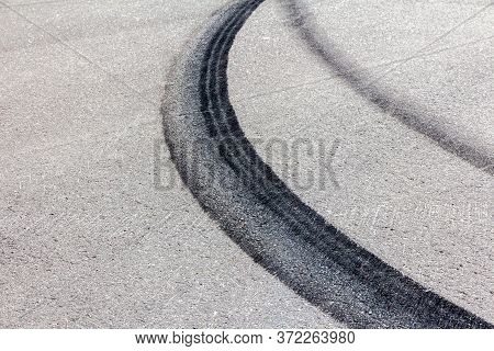 Black Marks Of Burnt Tires On The Pavement After Drift. Illegal Street Racing