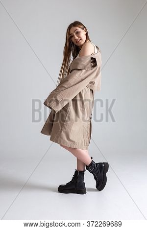 Attractive Caucasian Skinny Girl With Long Hair Posing On White Cyclorama. Beauty Portrait, Model Te