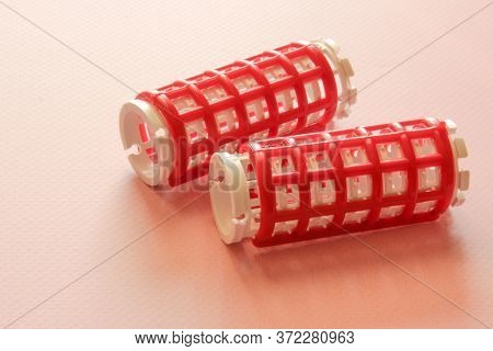 Hair Culers On The Pink Backround. Red Culers For Hairdress. Flat Lay