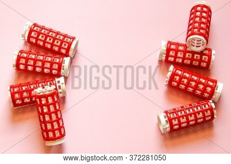 Hair Culers On The Pink Backround. Red Culers For Hairdress. Flat Lay