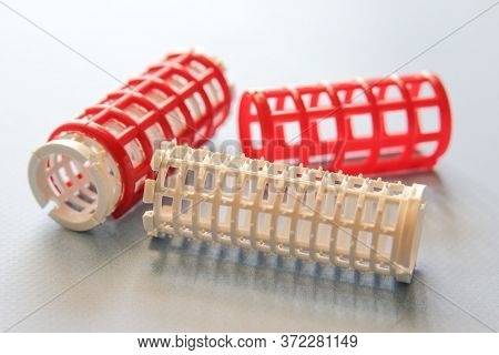 Hair Culers On The Blue Backround. Red Culers For Hairdress. Flat Lay