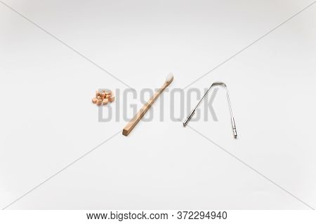 Bamboo Toothbrush, Metal Tongue Scrapper And Orange Tooth Tablets. Zero Waste, Ecological Oral Hygie