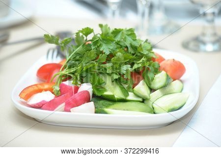 Sliced Fresh Vegetables On  A White Plate