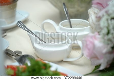White Saucers On The Table Close Up