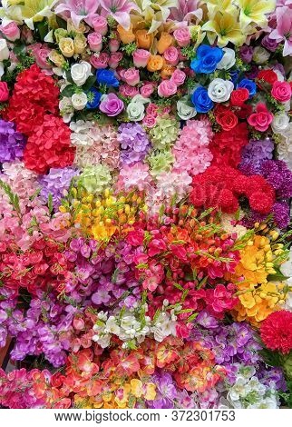 Colorful Artificial Flowers Top View Multicolor Bouquet Full Frame, Vertical Picture, Beautiful Back