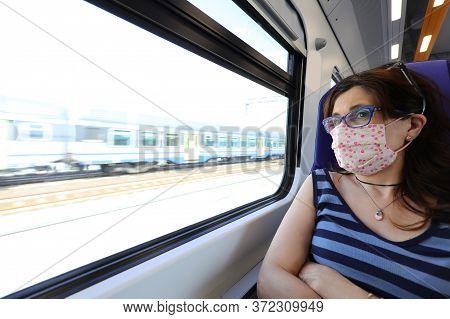 Pretty Woman With Surgical Mask Travel By Train During The Emergency Of Corona Virus