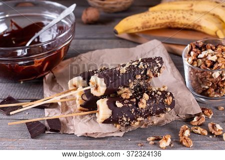 Homemade Frozen Chocolate Covered Bananas On A Stick. Sweet Dessert