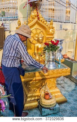 Yangon, Myanmar - December 15, 2016: Local Man At Botataung Paya Pagoda In Yangon, Maynmar