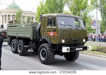 Donetsk, Donetsk Peoples Republic, Ukraine, May 9, 2018. A Convoy Of Military Vehicles With Artiller