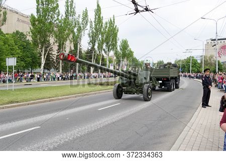 Donetsk, Donetsk Peoples Republic, Ukraine, May 9, 2018. A Convoy Of Military Vehicles With Artiller