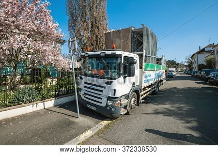 Strasbourg, France - Mar 18, 2020: View Of Scania P320 Truck With Loaded Scaffolding Near An Apartme