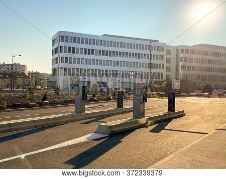 Strasbourg, France - April 2, 2020: Empty Parking And Closed Barriers Security Fences During Covid-1