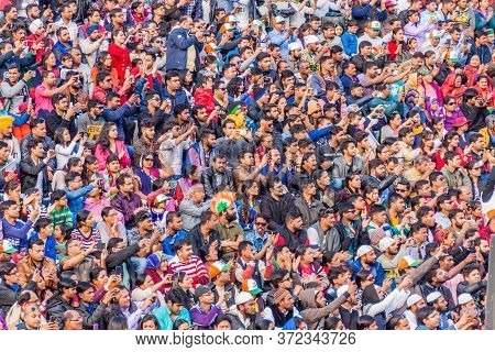 Wagah, India - January 26, 2017: Spectators Watch The Military Ceremony At India-pakistan Border In 