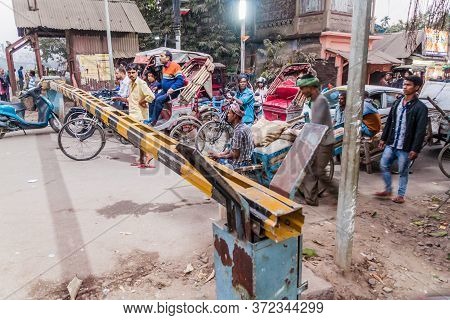 Guwahati, India - January 31, 2017: People Are Waiting At The Railway Crossing In Guwahati, India