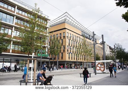 German People And Foreign Travelers Walking And Wait Tramway And Bus And Travel Visit Shopping In Ma