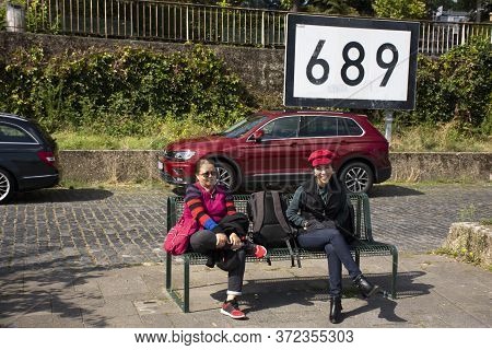 Thai Senior Mother And Young Daughter Women Sitting Rest Relax On Bench Rhine Garden Or Rheingarten 