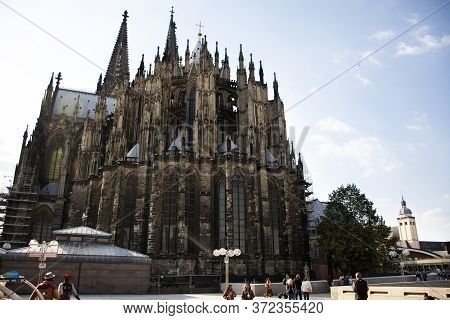 German People And Foreign Travelers Travel Visit And Respect Praying God At Cologne Cathedral Or Hoh
