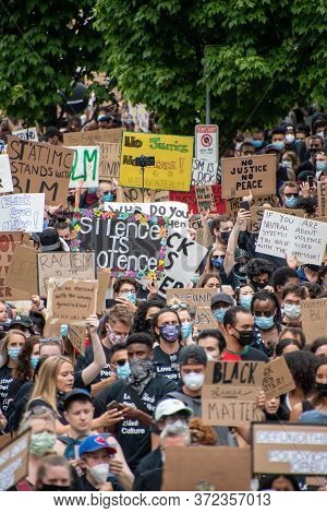 Junteenth     Protestors Holding Up Signs During Anti-racism March.   Vancouver  Bc Canada    June 1