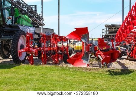 Kyiv, Ukraine - June 16, 2020: Large Disc Plough Unlu, Towing For Tractors To Plow Fields, Against T