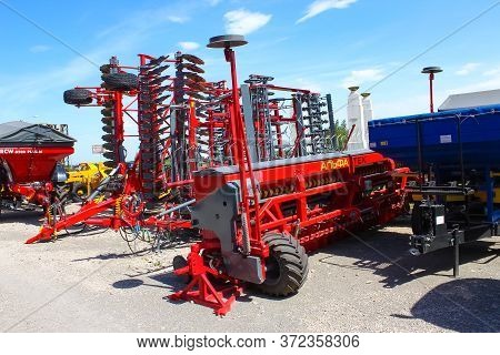 Kyiv, Ukraine - June 16, 2020: Large Disc Plough Unlu, Towing For Tractors To Plow Fields, Against T