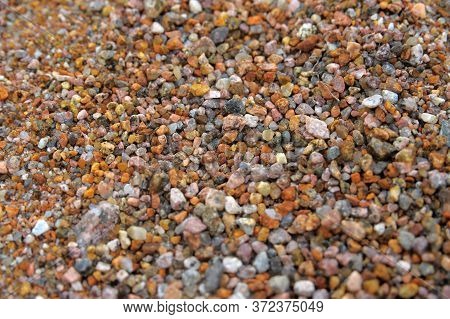 Small Gravel With Brown Cement Background