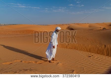 Al Wasil, Oman - March 5, 2017: Local Bedouin In The Sand Dunes Of Sharqiya Wahiba Sands Near Al Was