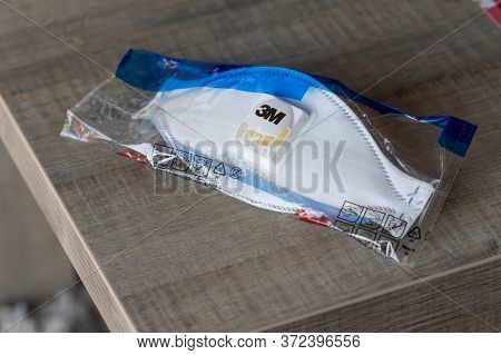 Brecht/belgium - May 5 2020: A Portrait Of A Dust Mask Still In Its Packaging During The Corona Pand