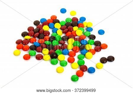 Colorful Chocolate M&ms In And Out Of Focus On White Background.