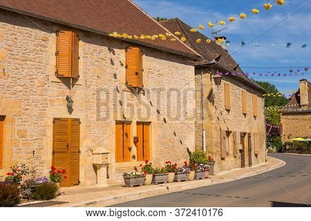 Street with historical houses in Saint-Leon-sur-Vezere, Dordogne,France