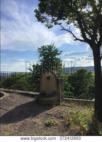 Old Fountain In Stone And Tree In Ansouis Provence